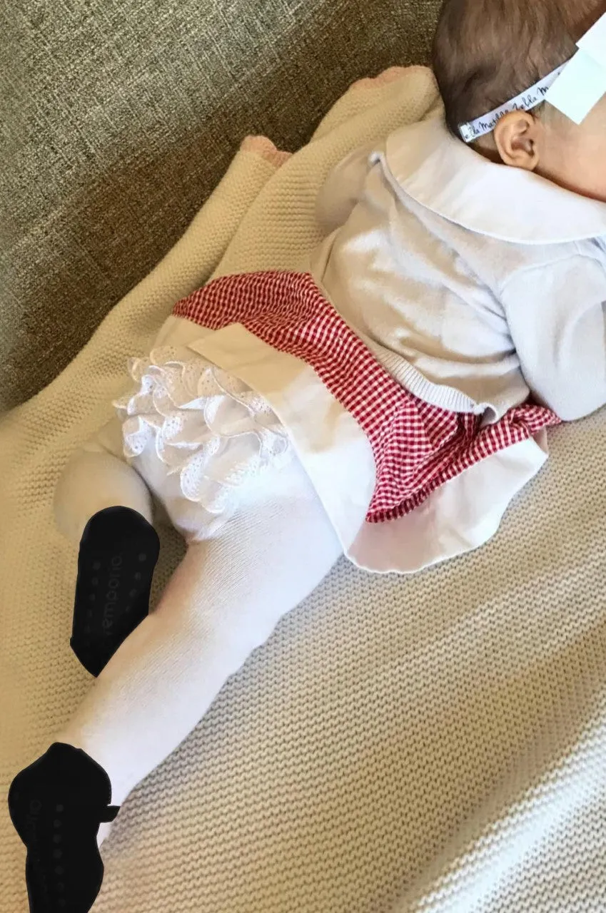 Baby girl ruffle bottom tights with sewn-in black shoe design.  Anti-slip soles. 0-6 months